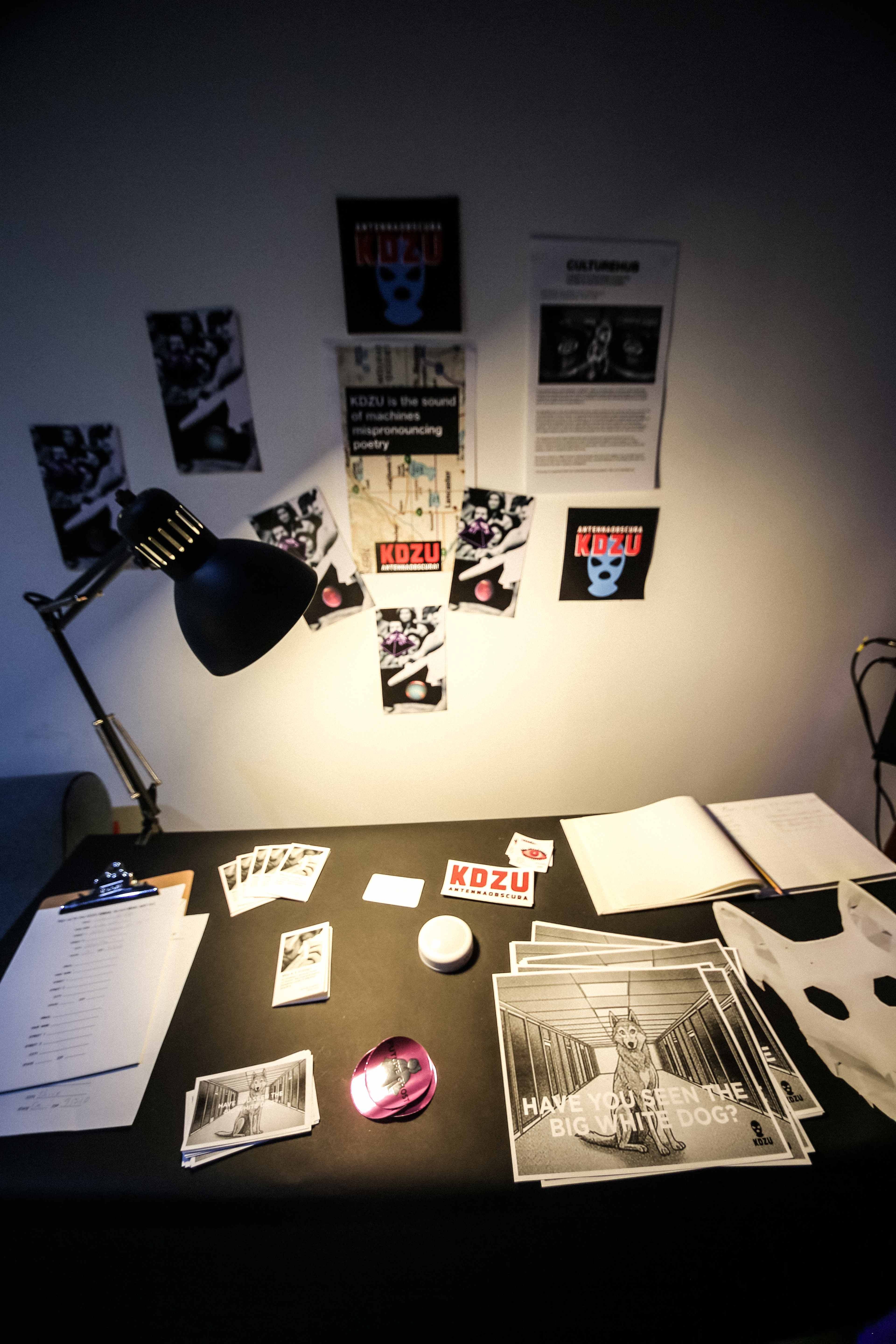 A table covered in KDZU ephemera.